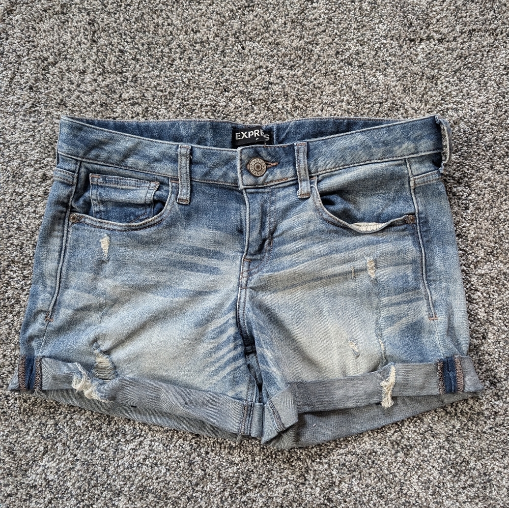 Express ultimate stretch midi low rise jean shorts